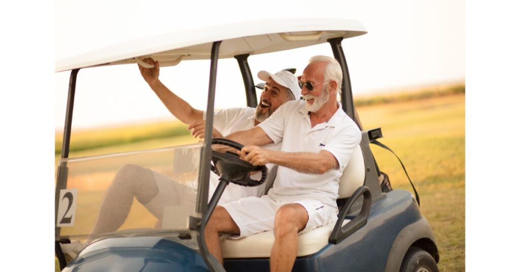 2 men driving around with a golf cart